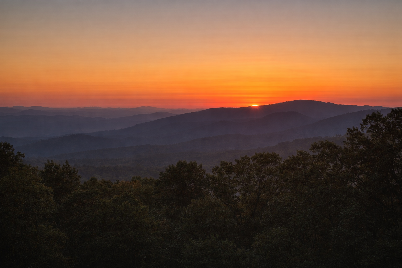 Mountain sunrise through mist
